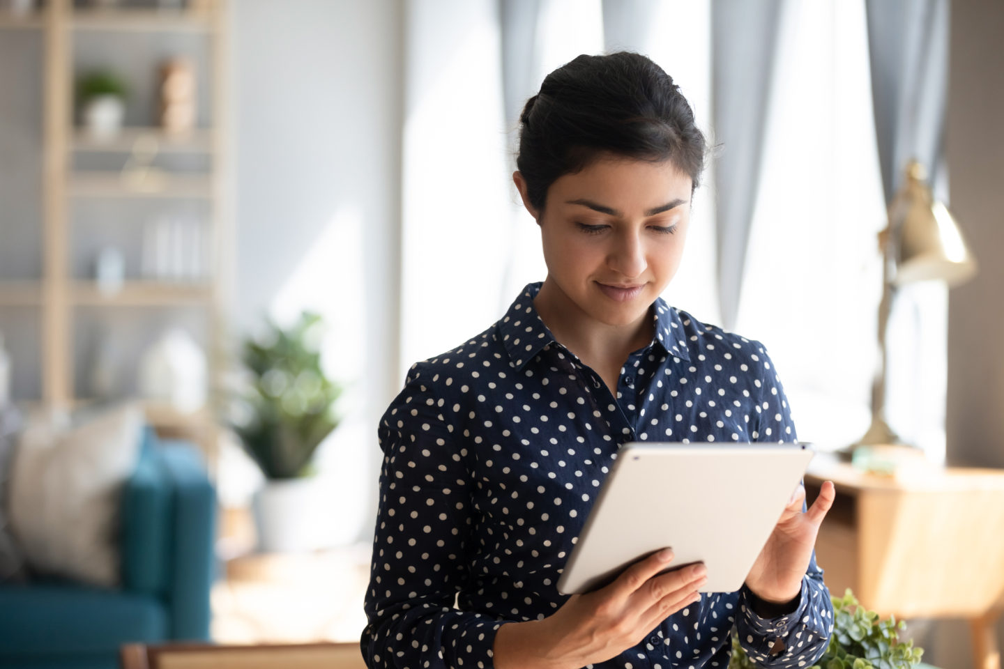 https://www.baywater.co.uk/app/uploads/2022/07/Young-indian-girl-using-digital-tablet-stand-at-home-office-1440x960.jpeg